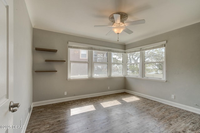 unfurnished room featuring hardwood / wood-style floors and ceiling fan