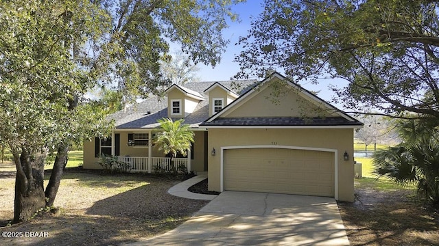 view of front facade featuring a garage and a porch