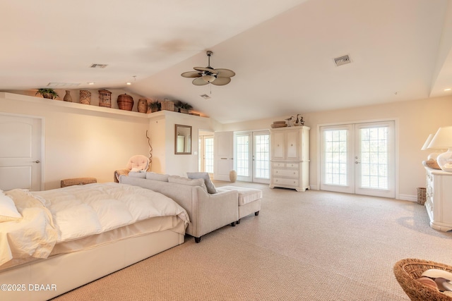 bedroom featuring french doors, access to outside, vaulted ceiling, ceiling fan, and light colored carpet