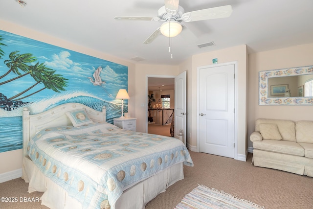 bedroom with ceiling fan and light carpet