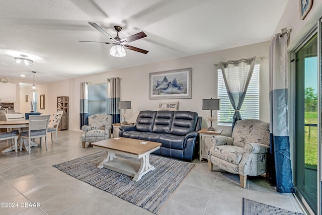 1362 Cork Dr, Ormond Beach, FL 32174 - living area featuring ceiling fan and light tile patterned flooring