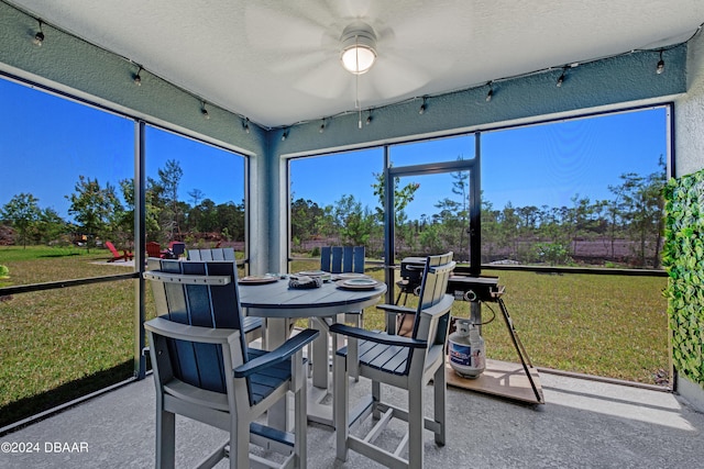 1362 Cork Dr, Ormond Beach, FL 32174 - sunroom / solarium featuring a ceiling fan and outdoor dining area