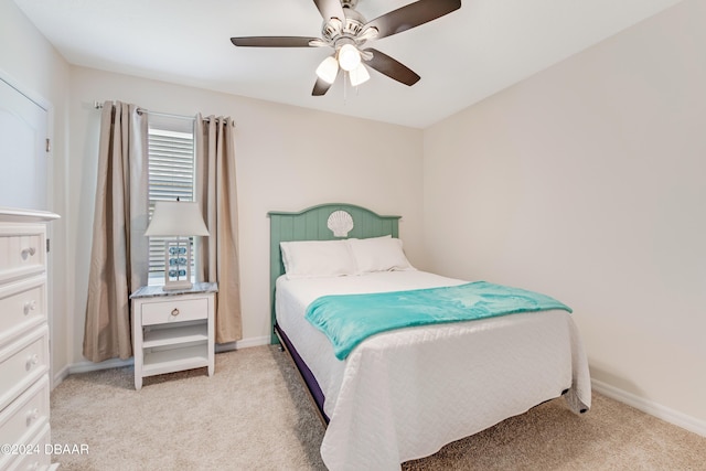 1362 Cork Dr, Ormond Beach, FL 32174 - bedroom with light colored carpet, a ceiling fan, and baseboards