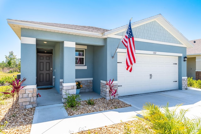 1362 Cork Dr, Ormond Beach, FL 32174 - view of front of house featuring an attached garage, concrete driveway, a shingled roof, and stucco siding