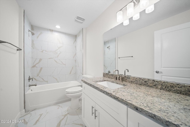 full bathroom with tiled shower / bath, toilet, and vanity