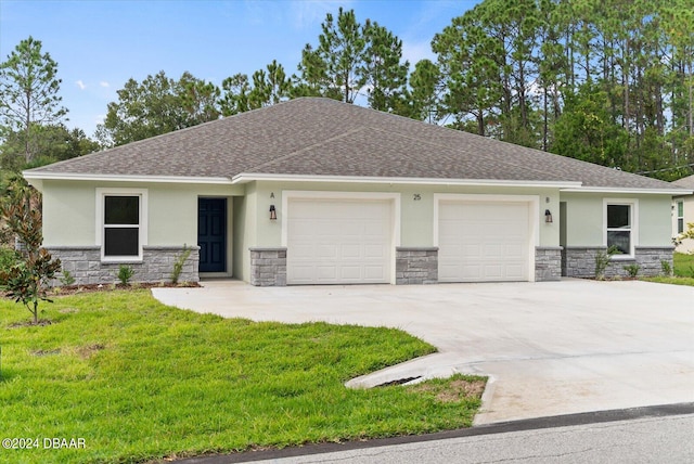 view of front facade featuring a garage and a front lawn