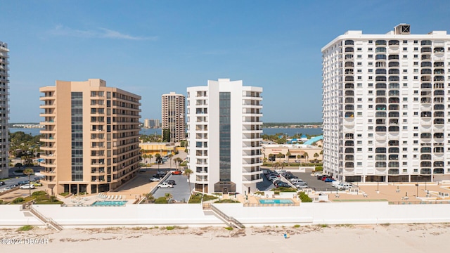 view of property featuring a view of city and a water view