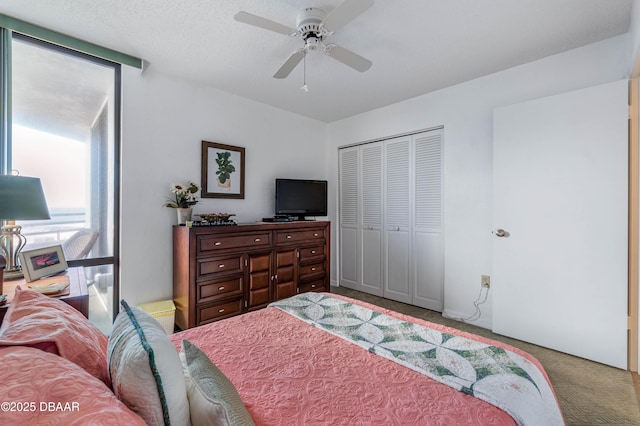 bedroom featuring ceiling fan, carpet floors, and a closet