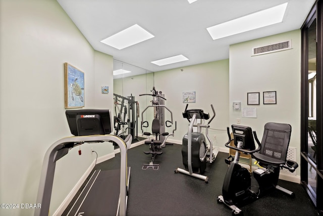 gym featuring visible vents and baseboards