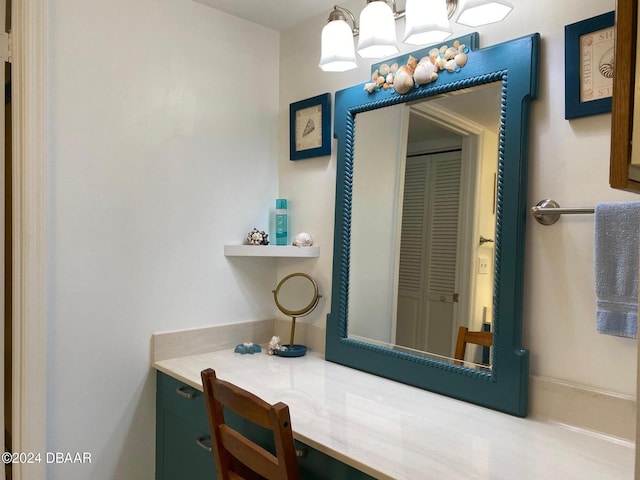 bathroom with a closet and vanity