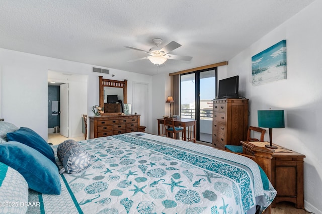 bedroom with access to exterior, visible vents, ceiling fan, a textured ceiling, and baseboards