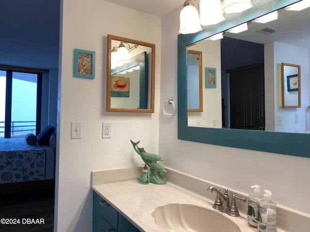 ensuite bathroom with visible vents, ensuite bathroom, and vanity