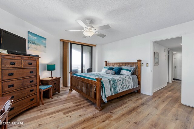 living room with hardwood / wood-style floors, a textured ceiling, ceiling fan, and sink