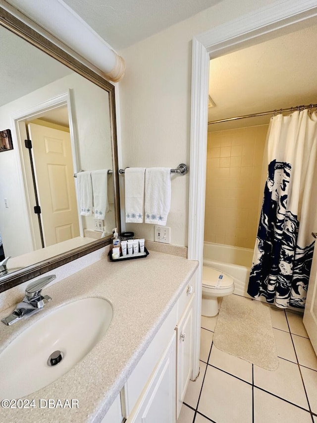 full bathroom with tile patterned floors, vanity, shower / bathtub combination with curtain, and toilet