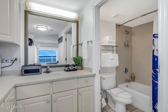 full bathroom featuring tile patterned floors, vanity, shower / tub combo, and toilet