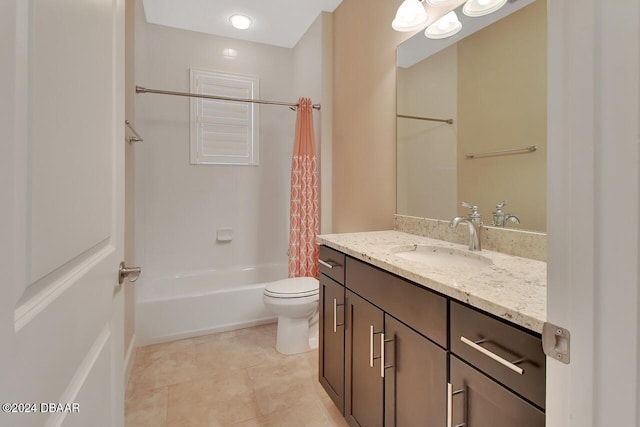 full bathroom with tile patterned floors, shower / bath combo with shower curtain, vanity, and toilet