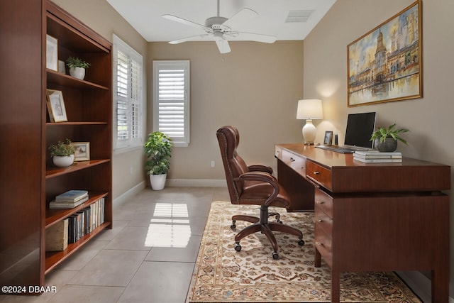 tiled office space featuring ceiling fan