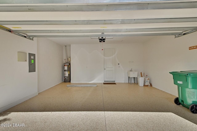 garage with electric panel, gas water heater, a garage door opener, and sink