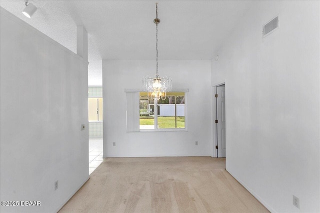 744 Hawks Ridge Rd, Port Orange, FL 32127 - unfurnished dining area with a chandelier and carpet flooring