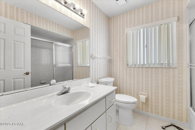 744 Hawks Ridge Rd, Port Orange, FL 32127 - bathroom featuring wallpapered walls, tile patterned flooring, a shower with shower door, and vanity