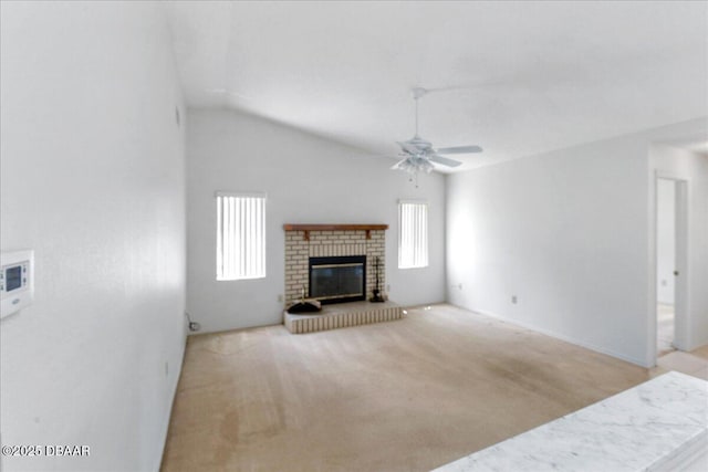 744 Hawks Ridge Rd, Port Orange, FL 32127 - unfurnished living room with healthy amount of natural light, a ceiling fan, a fireplace, vaulted ceiling, and carpet floors