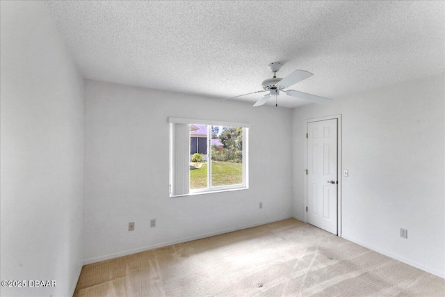 744 Hawks Ridge Rd, Port Orange, FL 32127 - unfurnished room with light carpet, ceiling fan, and a textured ceiling