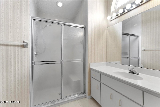 744 Hawks Ridge Rd, Port Orange, FL 32127 - bathroom with wallpapered walls, vanity, a stall shower, and tile patterned flooring