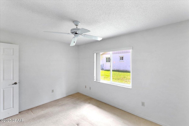 744 Hawks Ridge Rd, Port Orange, FL 32127 - empty room featuring light colored carpet, ceiling fan, and a textured ceiling