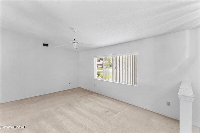 744 Hawks Ridge Rd, Port Orange, FL 32127 - spare room featuring light carpet, ceiling fan, and a textured ceiling