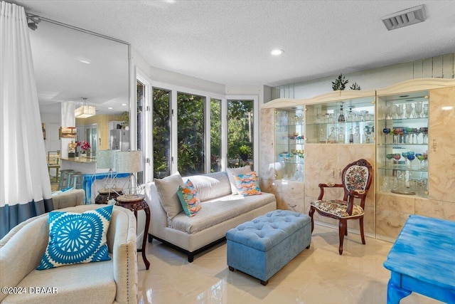 living room featuring a textured ceiling