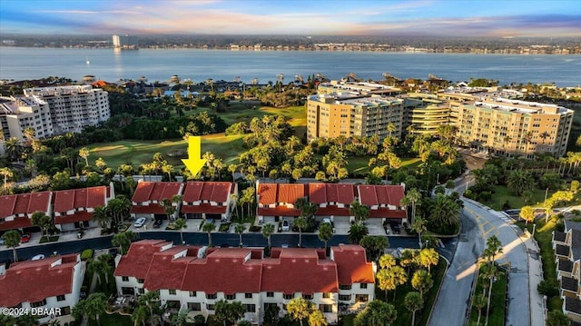 aerial view at dusk with a water view