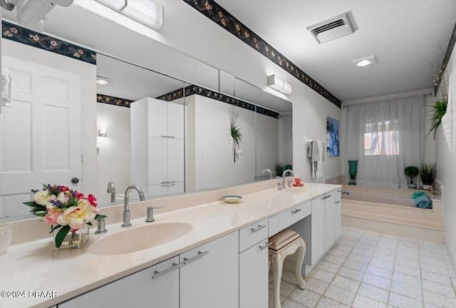 bathroom featuring vanity and a bathing tub