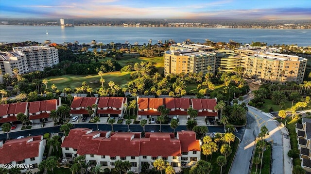 aerial view at dusk with a water view