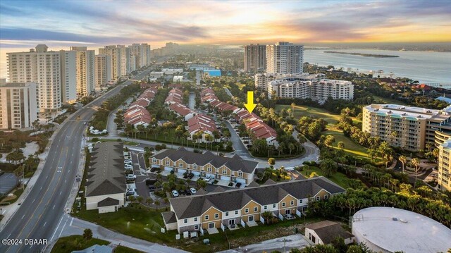 aerial view at dusk with a water view