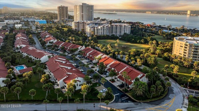 2934 Oceans Trce, Daytona Beach Shores, FL 32118 - aerial view at dusk of a water view, golf course view, and a city view