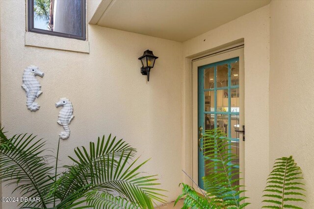 2934 Oceans Trce, Daytona Beach Shores, FL 32118 - property entrance with stucco siding