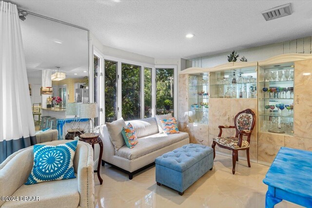 2934 Oceans Trce, Daytona Beach Shores, FL 32118 - living room with a textured ceiling and recessed lighting