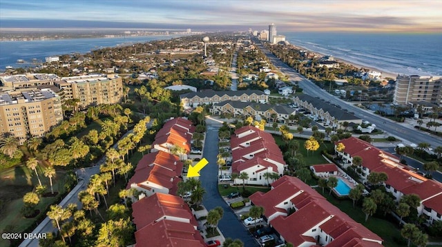 aerial view at dusk with a water view