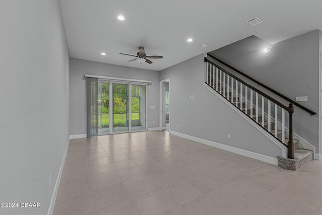 unfurnished living room featuring ceiling fan