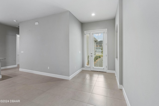 foyer featuring light tile patterned floors