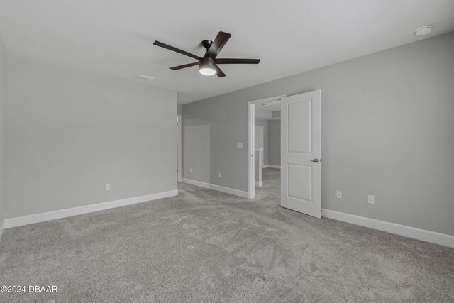 unfurnished bedroom with ceiling fan and light carpet