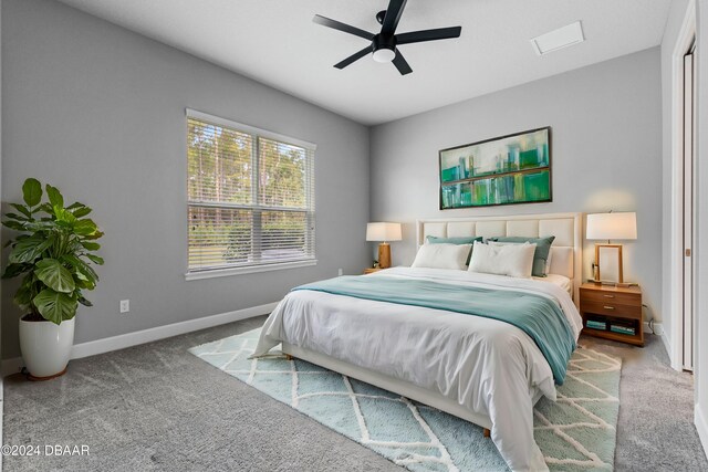 carpeted bedroom with ceiling fan