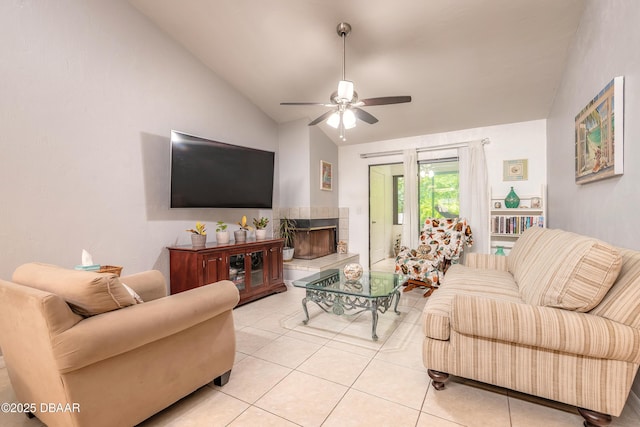 1237 Charter Oaks Cir, Holly Hill, FL 32117 - living area featuring vaulted ceiling, ceiling fan, light tile patterned floors, and a tiled fireplace