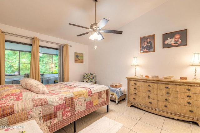 1237 Charter Oaks Cir, Holly Hill, FL 32117 - bedroom with vaulted ceiling, light tile patterned floors, and a ceiling fan