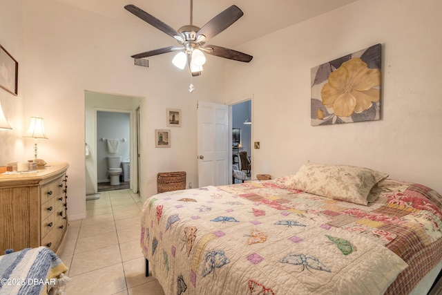 1237 Charter Oaks Cir, Holly Hill, FL 32117 - bedroom featuring a high ceiling, light tile patterned floors, connected bathroom, and ceiling fan
