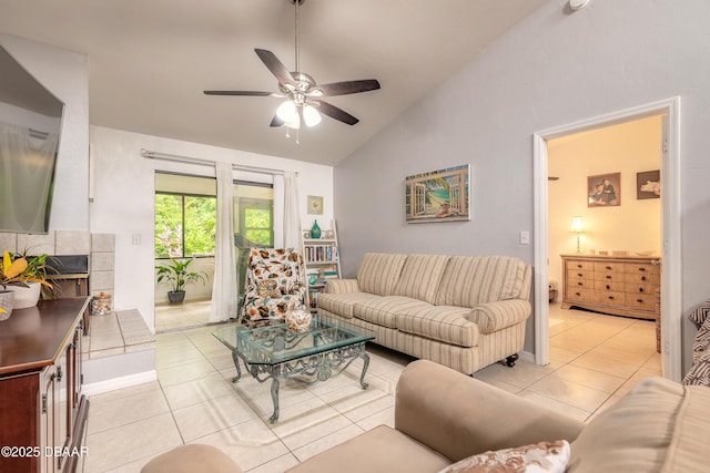 1237 Charter Oaks Cir, Holly Hill, FL 32117 - living area with vaulted ceiling, light tile patterned floors, a ceiling fan, and a tile fireplace