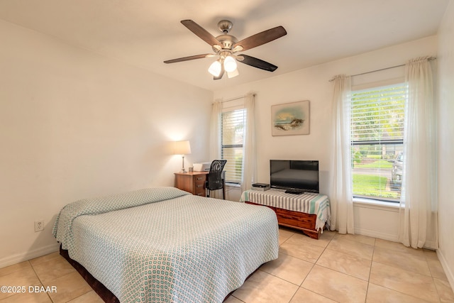 1237 Charter Oaks Cir, Holly Hill, FL 32117 - bedroom featuring multiple windows, light tile patterned floors, and ceiling fan