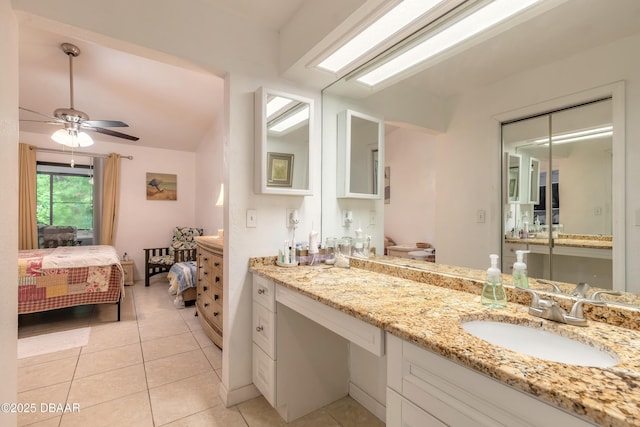 1237 Charter Oaks Cir, Holly Hill, FL 32117 - bathroom with ensuite bath, tile patterned flooring, vanity, and a ceiling fan