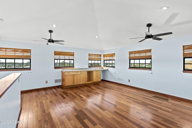 3726 S Atlantic Ave, New Smyrna Beach, FL 32169 - unfurnished living room featuring a ceiling fan, dark wood-style flooring, plenty of natural light, recessed lighting, and vaulted ceiling