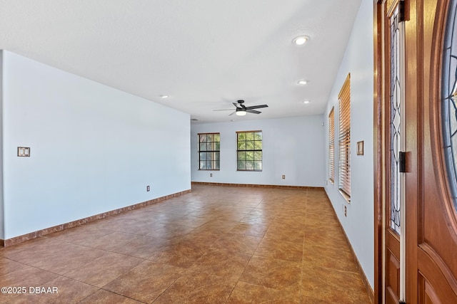 3726 S Atlantic Ave, New Smyrna Beach, FL 32169 - empty room with a ceiling fan and recessed lighting